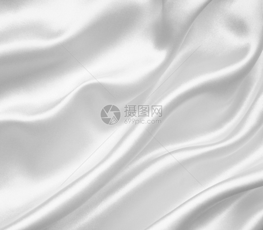 折痕柔软的采用平滑优雅白色丝绸或可以用作婚礼背景图片
