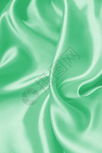 平滑优雅的绿色丝绸或纹质可用作背景美丽的窗帘柔软度图片