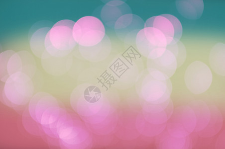 Bokeh抽象光绿色和粉红梯度颜背景概念爱夏天抽象的圆形闪亮背景图片