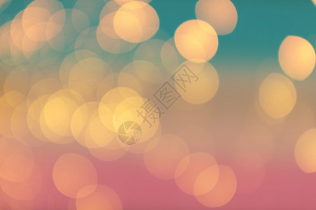 圣诞节粉彩Bokeh抽象光绿色和粉红梯度颜背景概念爱夏天圆形的背景图片