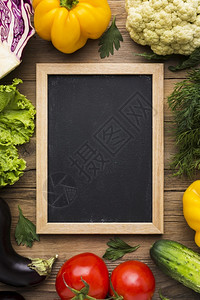 美丽黑色的带有蔬菜板顶上视图色彩多背景桌子图片