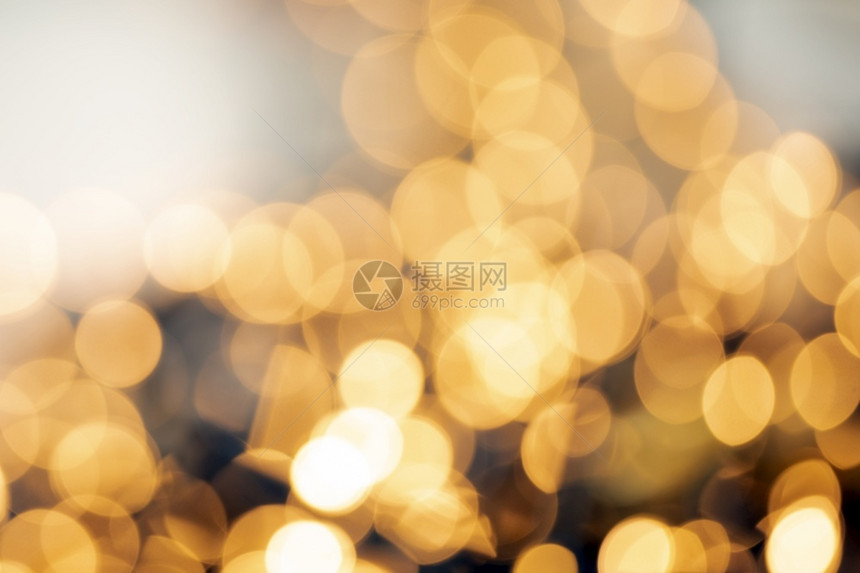 散焦金光抽象圣诞节或假日背景纹理闪发光的黄色模糊暖调彩散焦金光抽象圣诞节或假日背景纹理闪发光的黄色模糊暖调金子灰尘模糊的图片