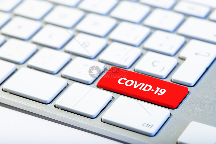 工作场所新冠带有红键和COVID19消息的冠状概念键盘电脑图片