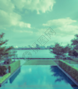 艾美酒店对抽象的河边模糊游泳池和城市风景背的美进行精观察虚拟过滤效应游泳的出去酒店设计图片