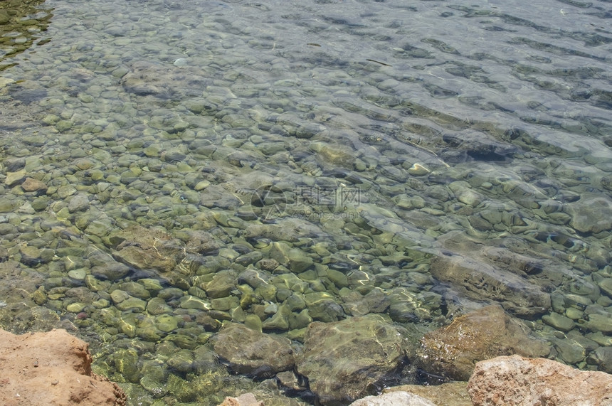 西班牙马洛卡omMallorca用于背景质地的浅光透明绿色海洋水岩浅光透明绿色海洋水岩自然户外巴利阿里图片