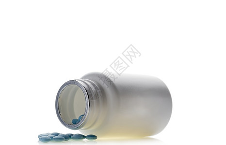 蓝色药丸孤立背景中的药瓶蓝色丸孤立白背景中的药瓶制卫生保健能够图片