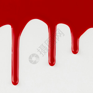 斑点红色的丙烯酸纤维红滴涂白背景图片