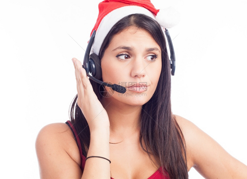 公司的称呼圣诞老人穿着红塔帽子的电话市场呼叫中心的圣诞头戴巾妇女在白种背景上微笑着说话图片
