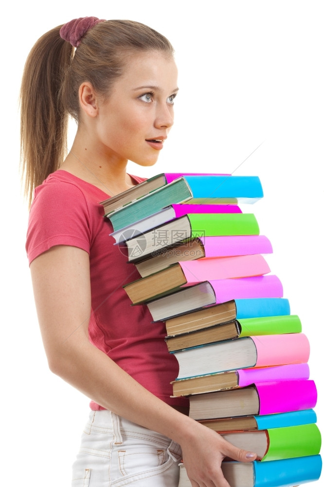 严肃的女学生在怀着许多彩的书籍和白背景外观时心烦意乱情感出去图片