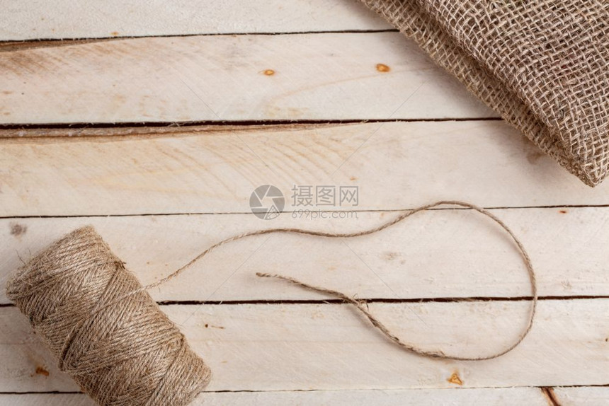 棉布木形背景上的画布和线条缠在一起羊毛复制空间图片