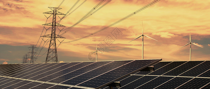 生态的清洁能源概念太阳电池板配有涡轮机和高电压塔的源阳光环境图片