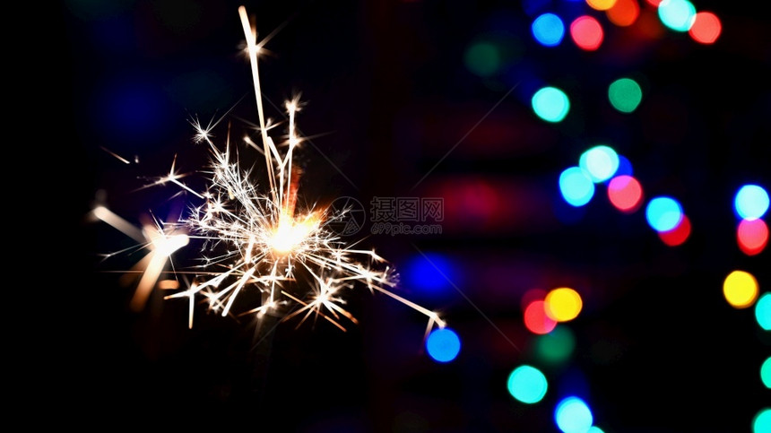 模糊辉光圣诞节和新年快乐的美丽颜色背景闪光灯概念Name圣诞和新年快乐生日图片