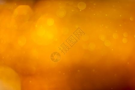 黄金橙色斑点或奢华闪光灯的喜庆背景魔法星典图片