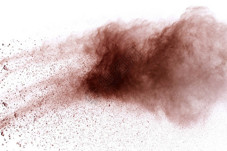 白色背景孤立的褐粉末爆炸着滑石粉推出背景图片