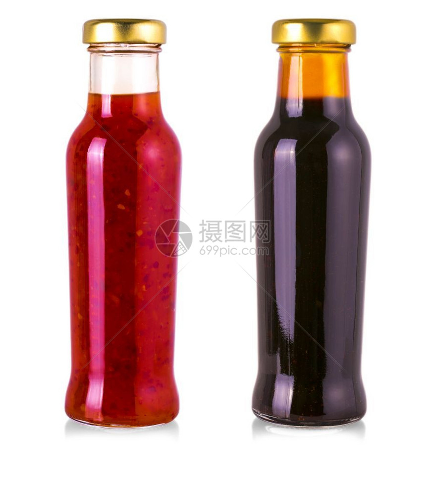 白色背景的玻璃瓶中各种烧烤酱汁目的番茄器具图片
