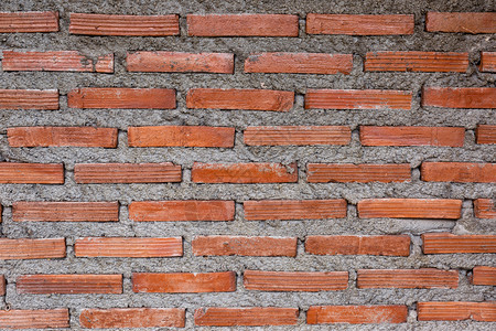 石方砖砌垃圾摇滚农村房间的红砖壁背景图片