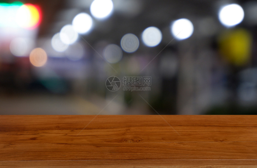 散景餐厅购物商场内地的空黑木桌面对抽象模糊的背景可以用来展示或装配产品图象片房间桌上图片
