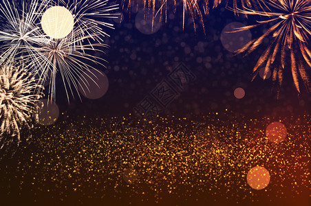 发光的天空快乐含有烟花庆祝和周年纪念概的金黑色和橙闪亮背景摘要黄金图片