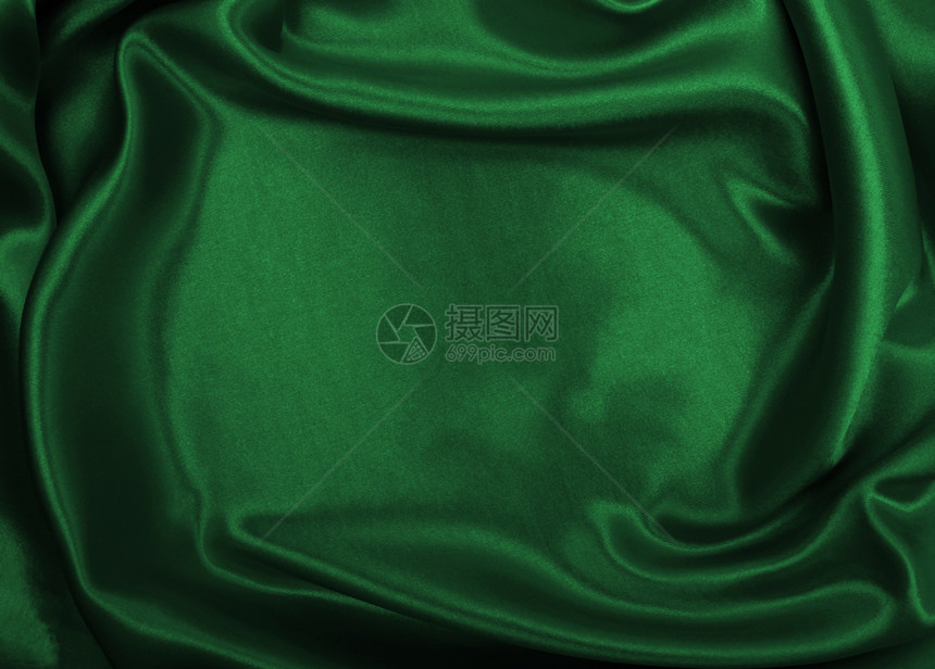 明亮的或者能够平滑优雅的绿色丝绸或席边奢华布质料可用作抽象背景豪华设计图片