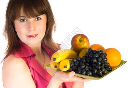 美丽的女孩有水果盘子孤立在白色的菜上饮食健康快乐的图片