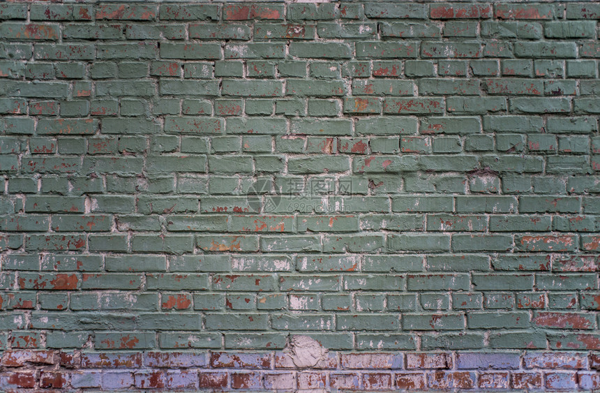质地基辅乌克兰绿色和红砖墙背景的铁板工业壁绿色和红砖墙粗糙的结石图片