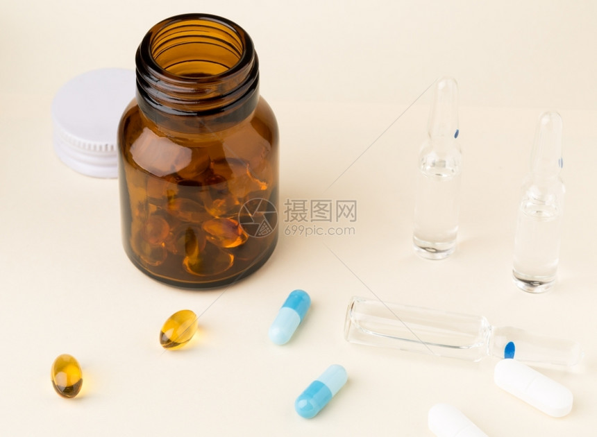 药剂学瓶子来自棕色玻璃和彩胶囊的药瓶补充图片