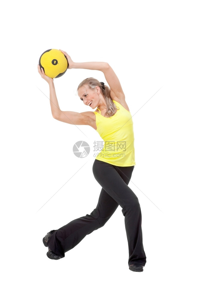 灵活美貌优雅的年轻女子与黄色和黑的球一起锻炼运动黄色和黑白的微笑图片