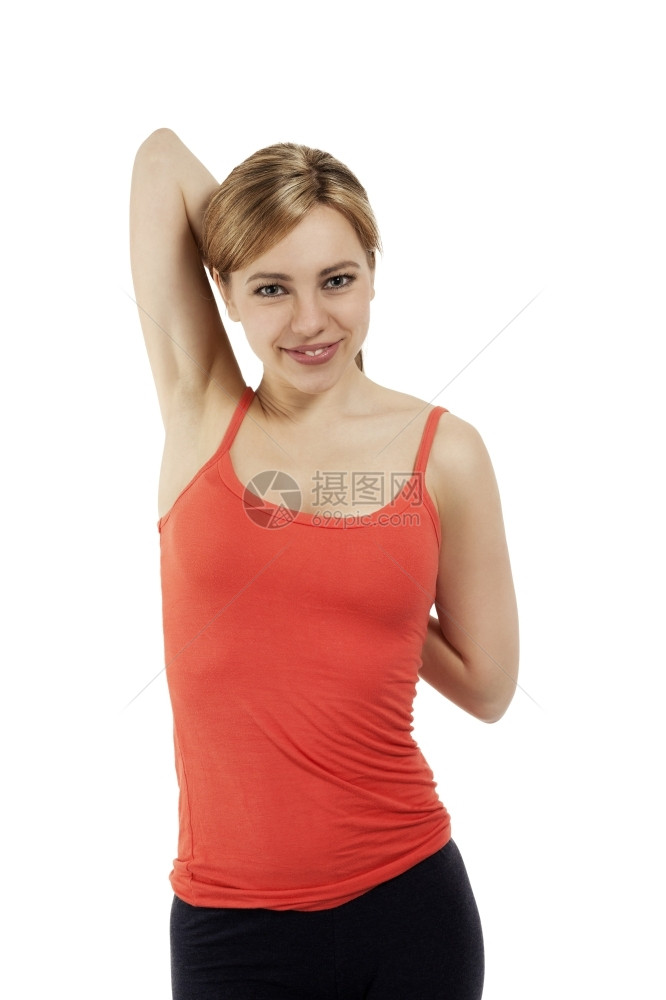 人们吸引的年轻健身女子在白种背景上伸展双臂将年轻健身女子拉长房图片