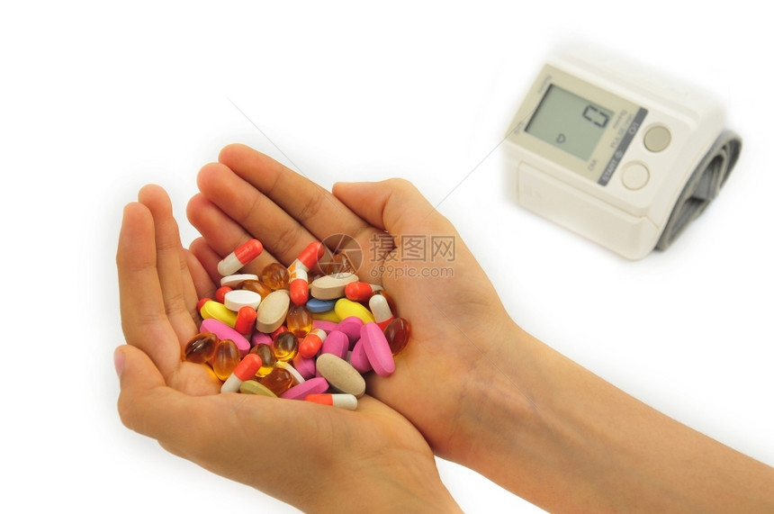 危险药店白背景的血压和药丸耐心图片