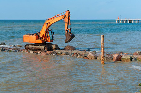 机器土壤海滩岸上施工设备防波堤施工海岸保护措施上工设备背景
