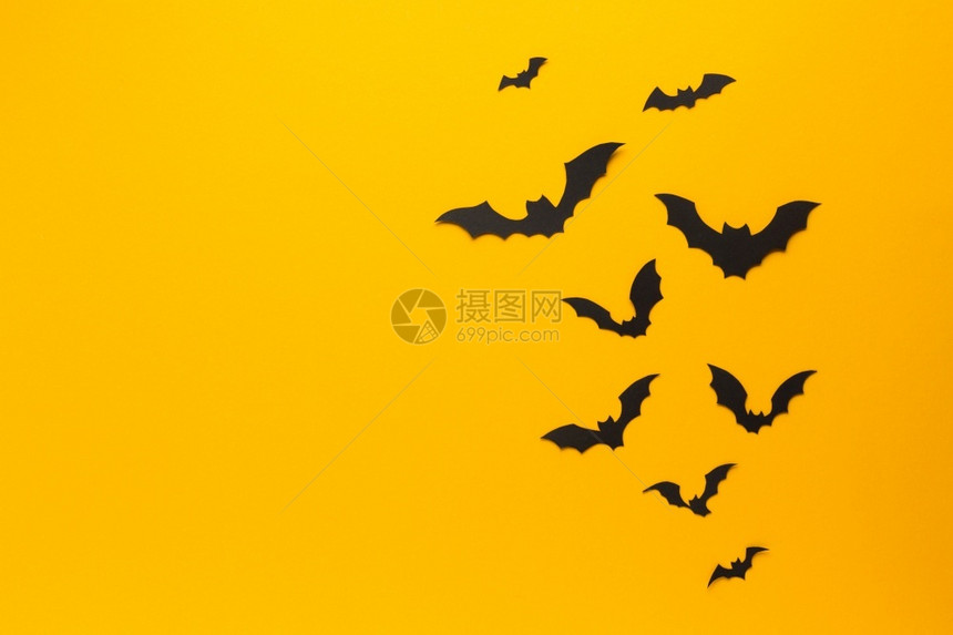 辉光公告橙色背景的神圣蝙蝠黑暗图片