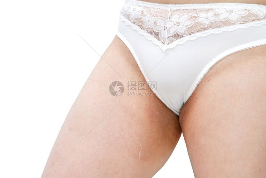 女健康穿着白内裤的女子在两腿间擦处施奶油领域图片