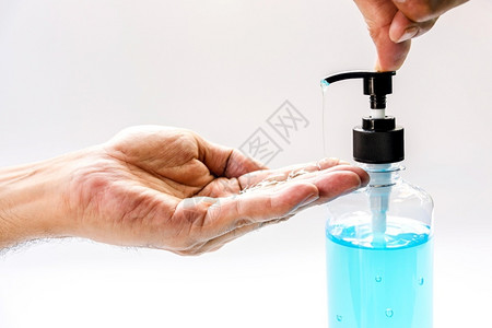 蓝色水凝胶创意塑料用酒精凝胶洗手以防止Corona感染Covid19医院新冠背景