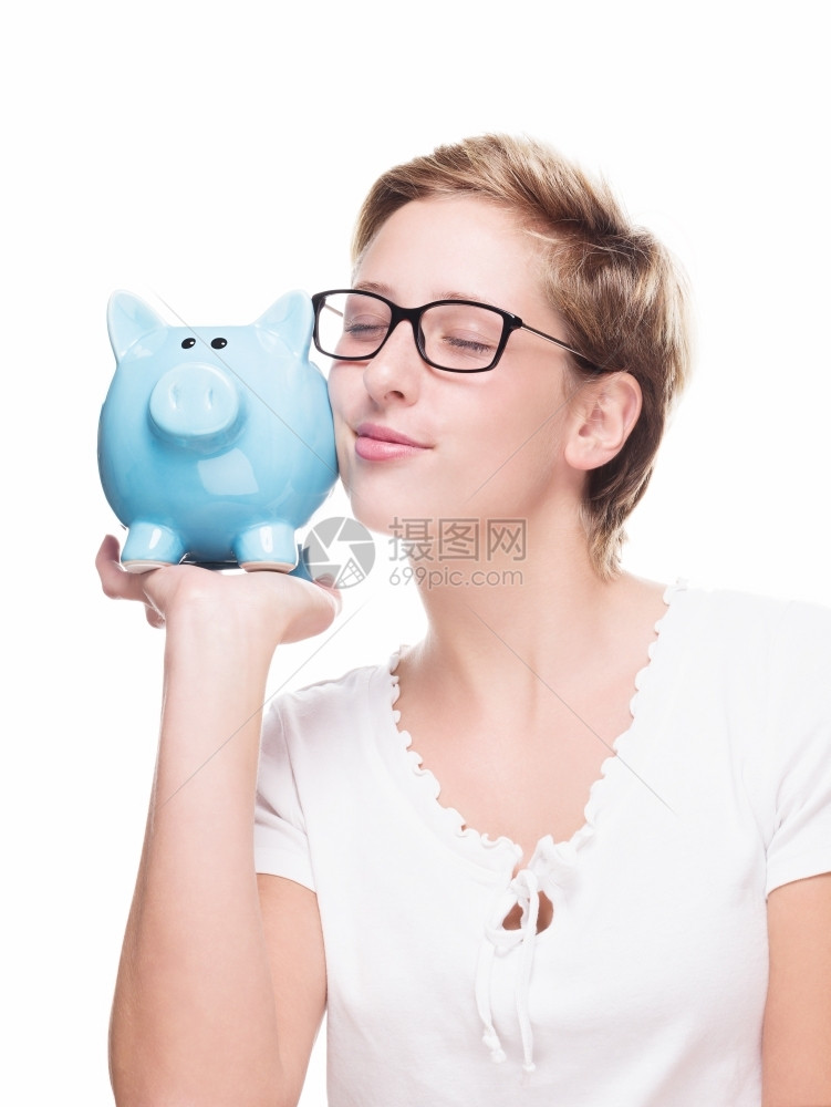 肖像金融储蓄可爱的发美女拥抱着一个小猪银行可爱的金发美女拥抱着白种背景的小猪银行图片