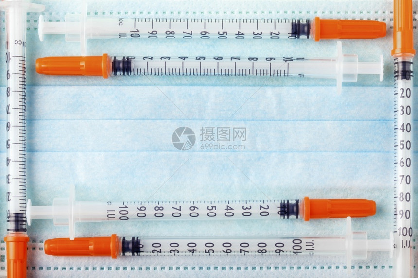 制药保护蓝面罩上框架状的胰岛素注射器入卫生图片