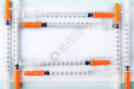 疫苗接种药品保护蓝面罩上框架状的胰岛素注射器化学图片