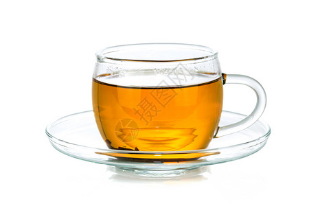 黄色的茶碗透明玻璃杯以白色背景隔绝在特写中松弛图片