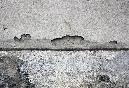 旧房子外墙上湿的石膏表面损坏外部粗糙图片