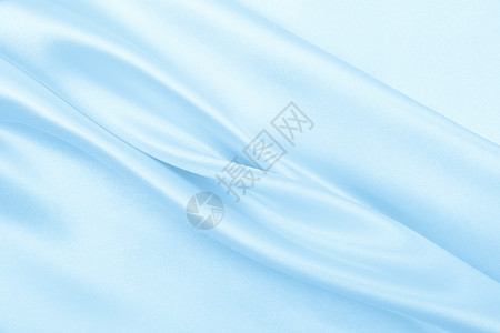 平滑优雅的蓝色丝绸或席边奢华布质料可用作抽象背景本色设计天蓝颜莫罗佐娃背景图片