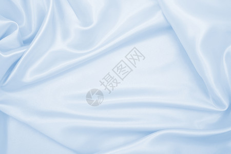 材料缎面平滑优雅的蓝色丝绸或席边奢华布质料可用作抽象背景本色设计折痕图片
