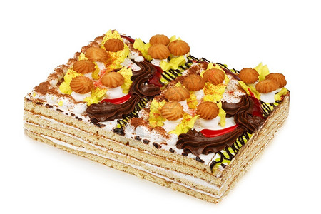 上面装饰着奶油蘑菇的蛋糕在白色背景上隔绝富有的面包店白色图片