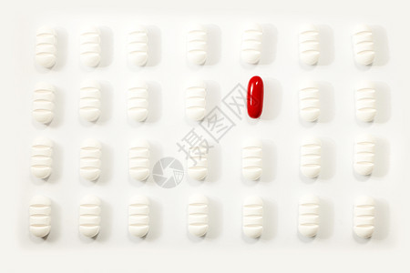 眼神捕捉者片剂许多白色药丸红的白背景动机镇痛剂设计图片