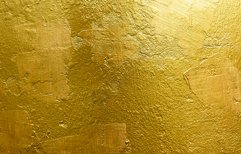 金色背景或纹理和影子旧墙壁刮痕垃圾摇滚防锈的金图片