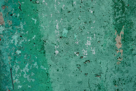 蓝晶绿色纹质的破旧墙壁背景日光近距离空间有油漆污渍和洞孔白天纸图片