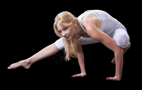 杂技演员放松脸年轻漂亮女孩在专业上从事瑜伽工作图片