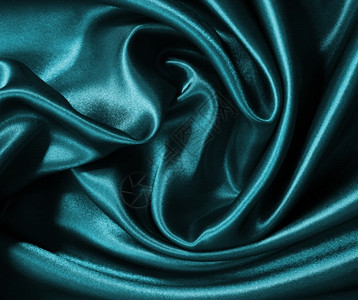 柔软的蓝色丝滑平优雅蓝色丝绸或可用作背景图片
