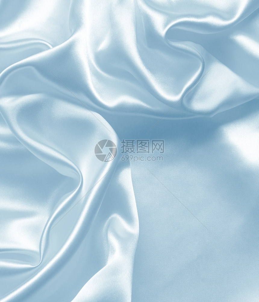 丰富多彩的平滑优雅蓝色丝绸或可用作背景蓝色的投标图片