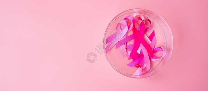 乳腺癌防治月关心10月提高乳腺癌意识月粉红背景色丝带以支持人们生活和疾病支持国际妇女母亲和世界癌症日概念国际妇女母亲和世界癌症日概念帕努瓦胸设计图片