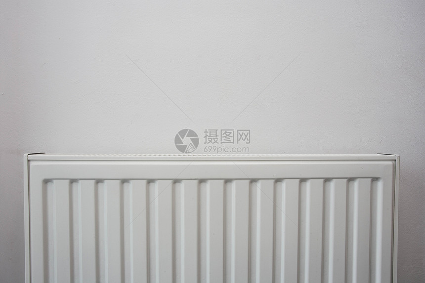 中央系统白墙上的色暖气片现代设计特写白墙上的色暖气片现代设计恒温器图片