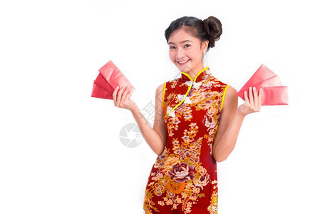 齐愉快美丽年轻亚洲容女穿着青相在新年节庆活动中携带红包钱关于孤立的白背景衣假日和生活方式概念穿Qipao服装图片
